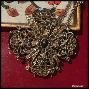 Long Necklace with Intricate Gold-Tone Pendant